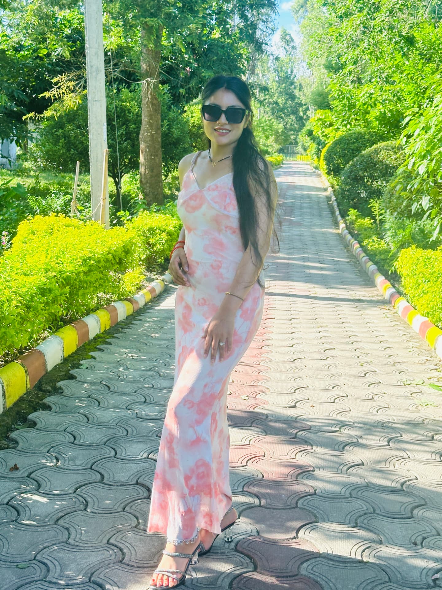 Baneeka Thapa on a garden walkway